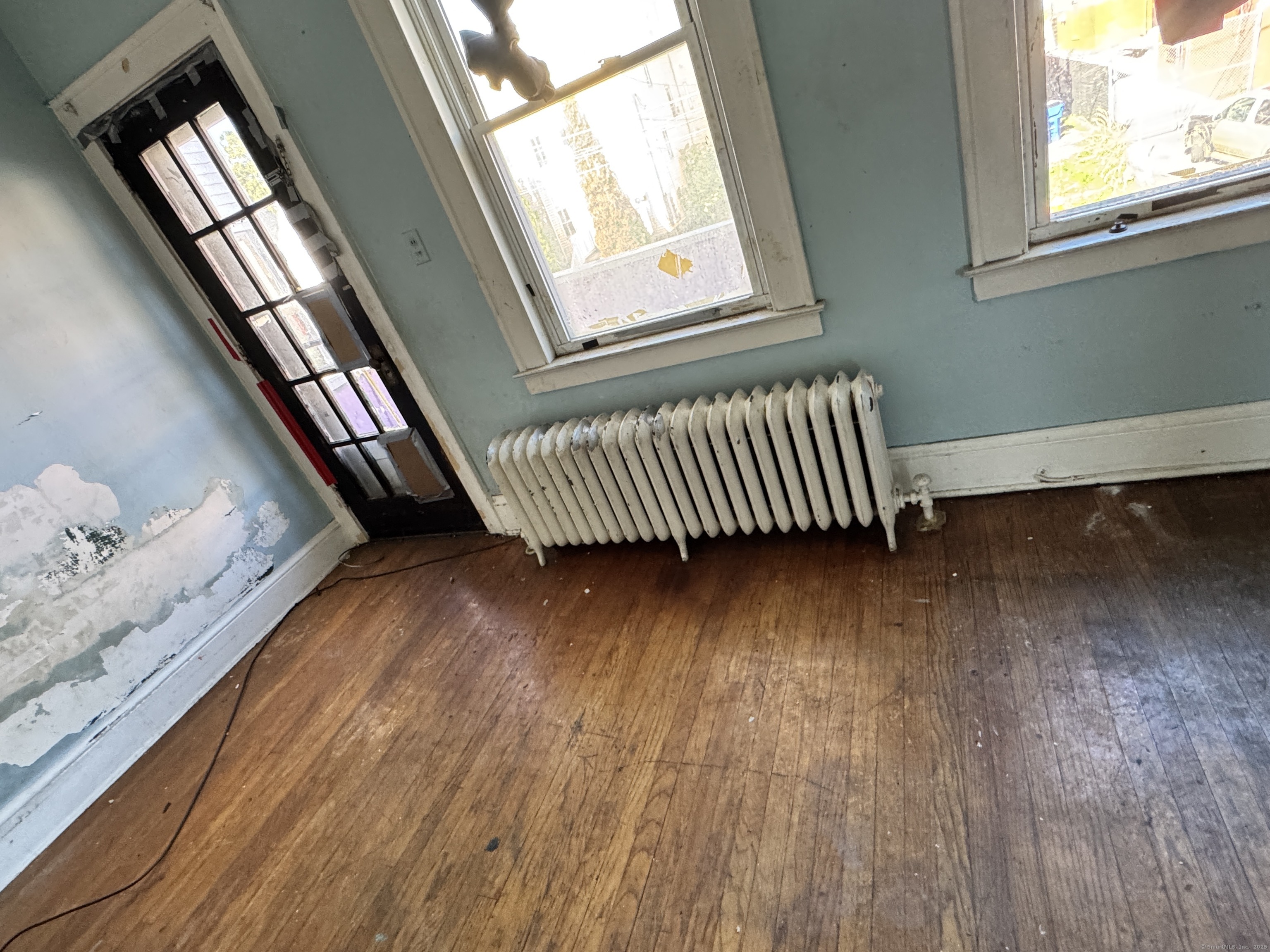 102 Rowe Avenue Hartford, CT 06106 - Photo 6 of 28 a view of a room with wooden floor and stairs