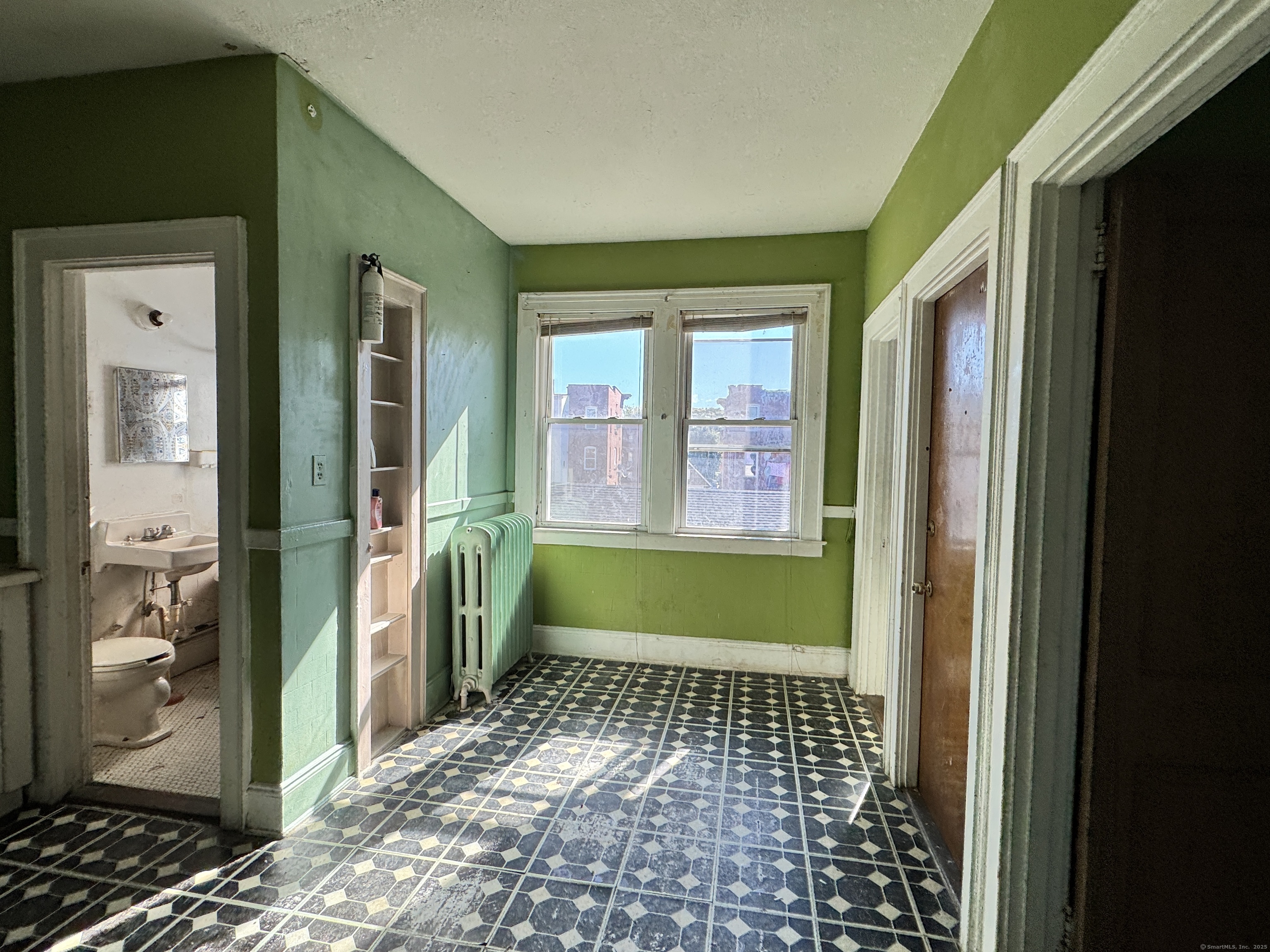 102 Rowe Avenue Hartford, CT 06106 - Photo 7 of 28 a front view of a house with a glass door