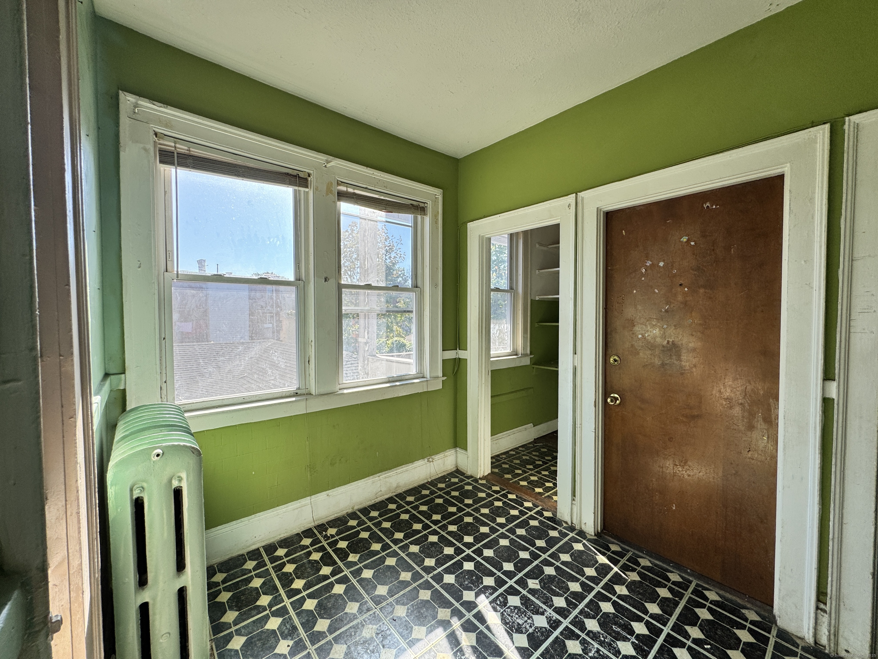102 Rowe Avenue Hartford, CT 06106 - Photo 9 of 28 a front view of a house with a green gate
