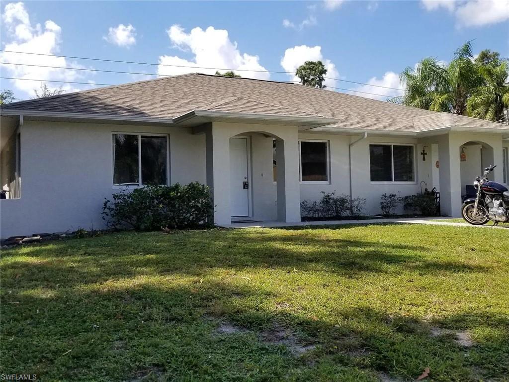 8208 Matanzas Road Fort Myers, FL 33967 - Photo 1 of 9 a view of a house with a garden