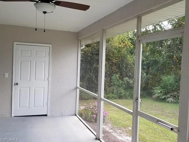 8208 Matanzas Road Fort Myers, FL 33967 - Photo 8 of 9 a view of a room that has a large window and wooden floor