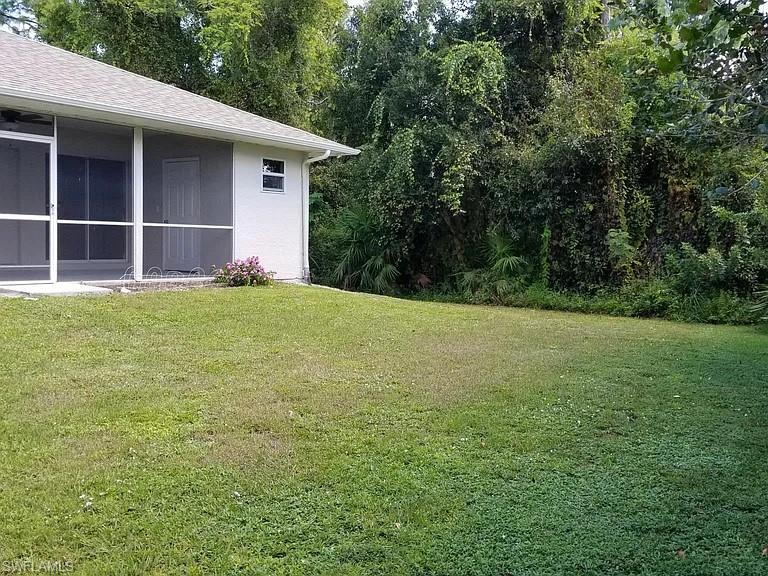 8208 Matanzas Road Fort Myers, FL 33967 - Photo 9 of 9 a view of a backyard with small cabin
