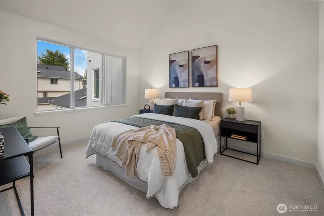 a bedroom with a bed and a mirror