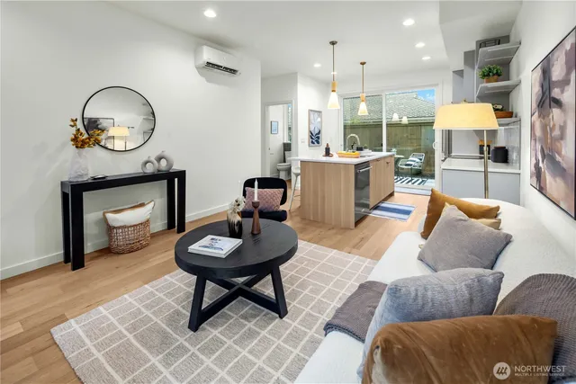 a living room with furniture a mirror and a fireplace