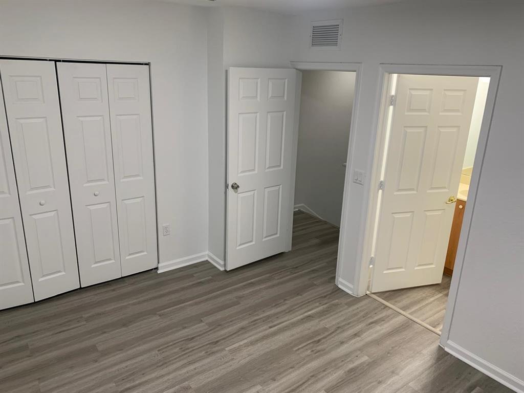 2663 Southwest 82nd Avenue, Unit 104 Miramar, FL 33025 - Photo 11 of 28 a view of empty room with wooden floor