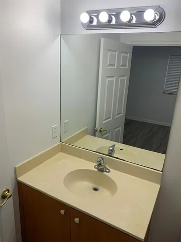 a bathroom with a toilet a sink and bathtub