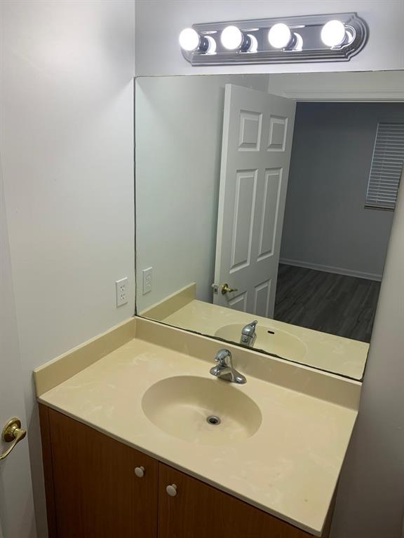 2663 Southwest 82nd Avenue, Unit 104 Miramar, FL 33025 - Photo 16 of 28 a bathroom with a sink vanity and mirror