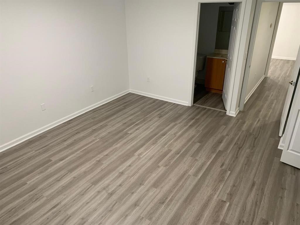 2663 Southwest 82nd Avenue, Unit 104 Miramar, FL 33025 - Photo 18 of 28 a view of a room with wooden floor