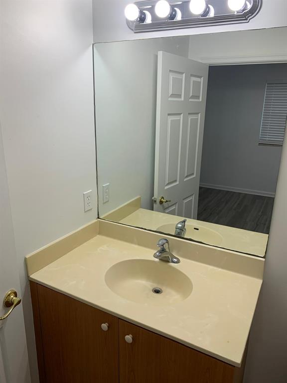2663 Southwest 82nd Avenue, Unit 104 Miramar, FL 33025 - Photo 20 of 28 a bathroom with a sink and a mirror