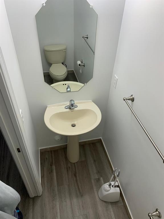 2663 Southwest 82nd Avenue, Unit 104 Miramar, FL 33025 - Photo 5 of 28 a bathroom with a sink toilet and mirror