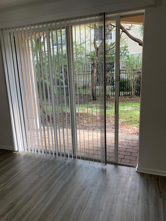 2663 Southwest 82nd Avenue, Unit 104 Miramar, FL 33025 - Photo 10 of 28 a view of wooden floor and window in an empty room