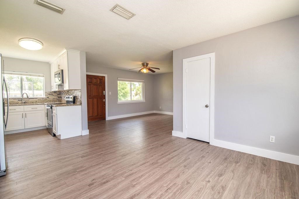 118 Menendez Road St. Augustine, FL 32080 - Photo 11 of 31 a view of a kitchen with a sink dishwasher and a refrigerator