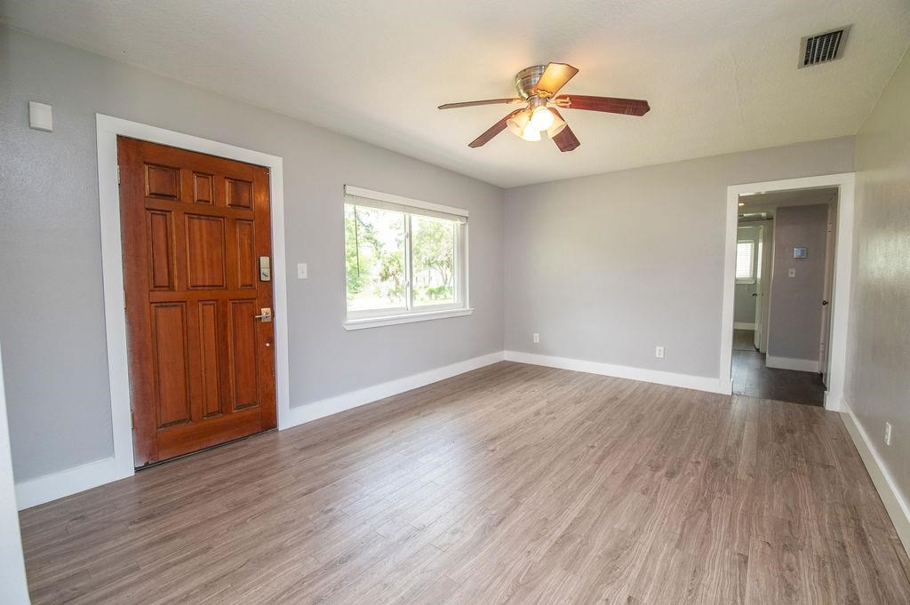 118 Menendez Road St. Augustine, FL 32080 - Photo 13 of 31 wooden floor in an empty room with a window