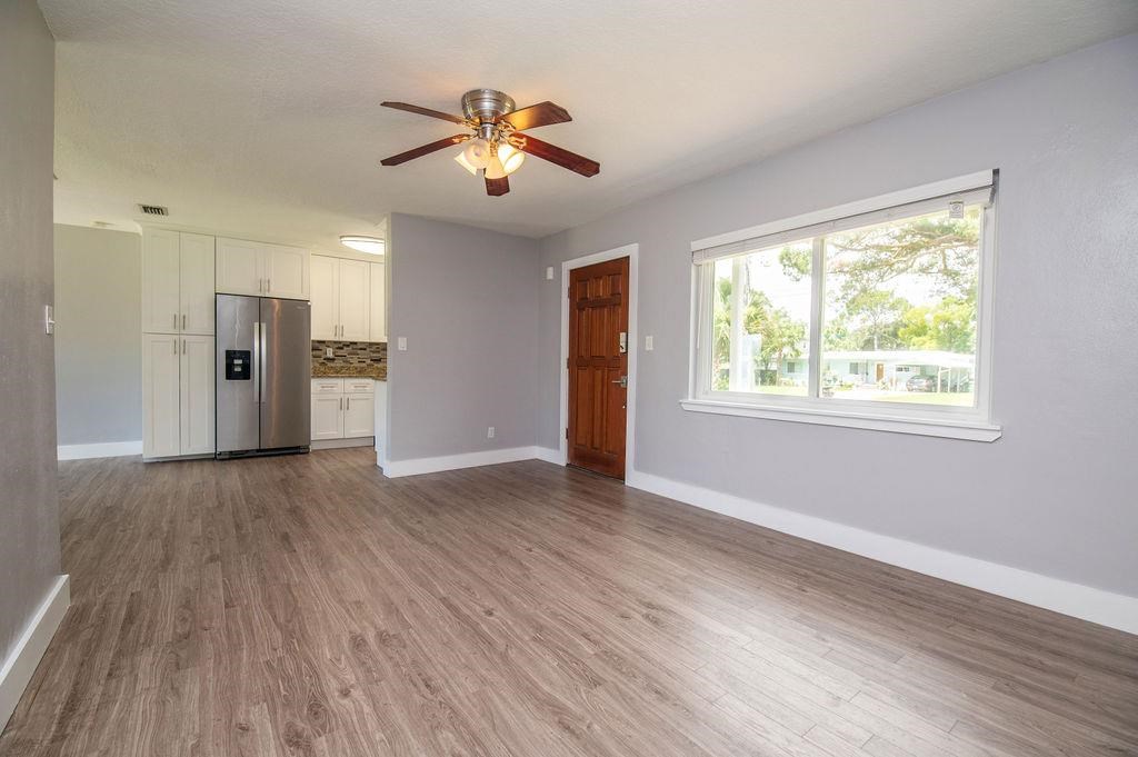 118 Menendez Road St. Augustine, FL 32080 - Photo 14 of 31 a view of an empty room with a window and wooden floor