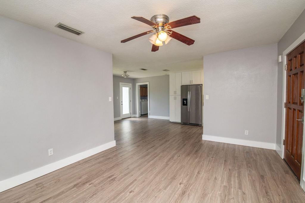 118 Menendez Road St. Augustine, FL 32080 - Photo 15 of 31 a view of an empty room with window and wooden floor