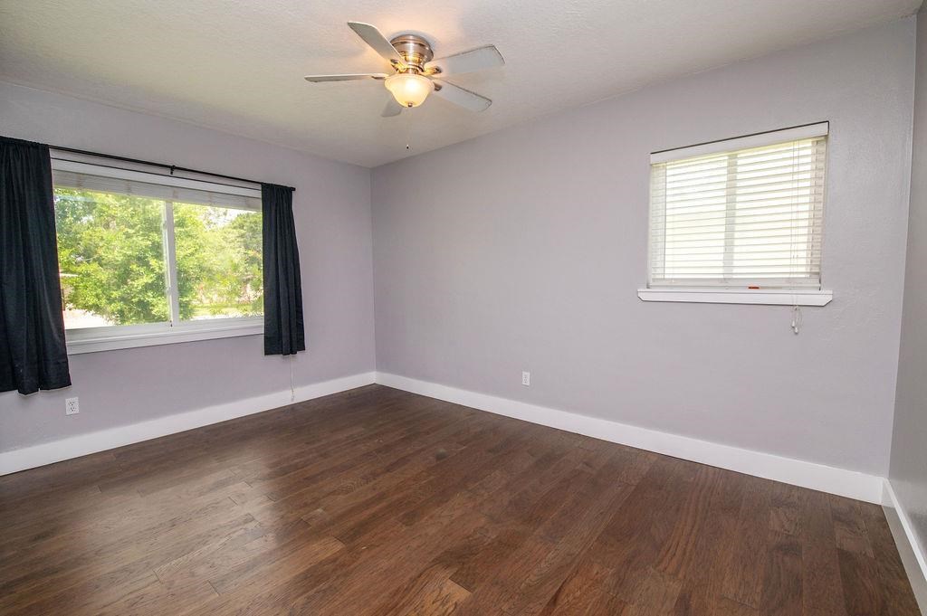 118 Menendez Road St. Augustine, FL 32080 - Photo 18 of 31 a view of an empty room with wooden floor and a window