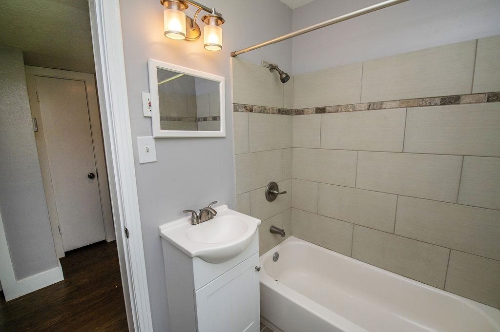 118 Menendez Road St. Augustine, FL 32080 - Photo 21 of 31 a bathroom with a sink and mirror with bathtub