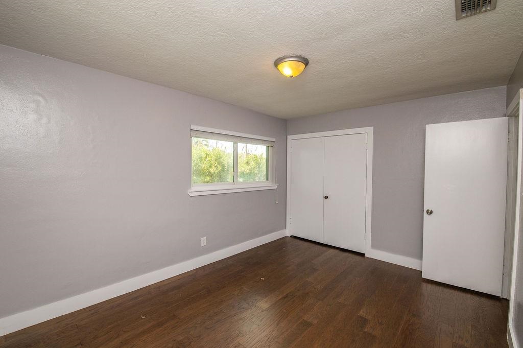 118 Menendez Road St. Augustine, FL 32080 - Photo 23 of 31 a view of a kitchen with wooden floor and window