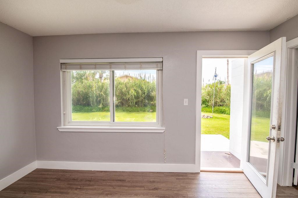118 Menendez Road St. Augustine, FL 32080 - Photo 24 of 31 a view of an empty room with wooden floor and a window