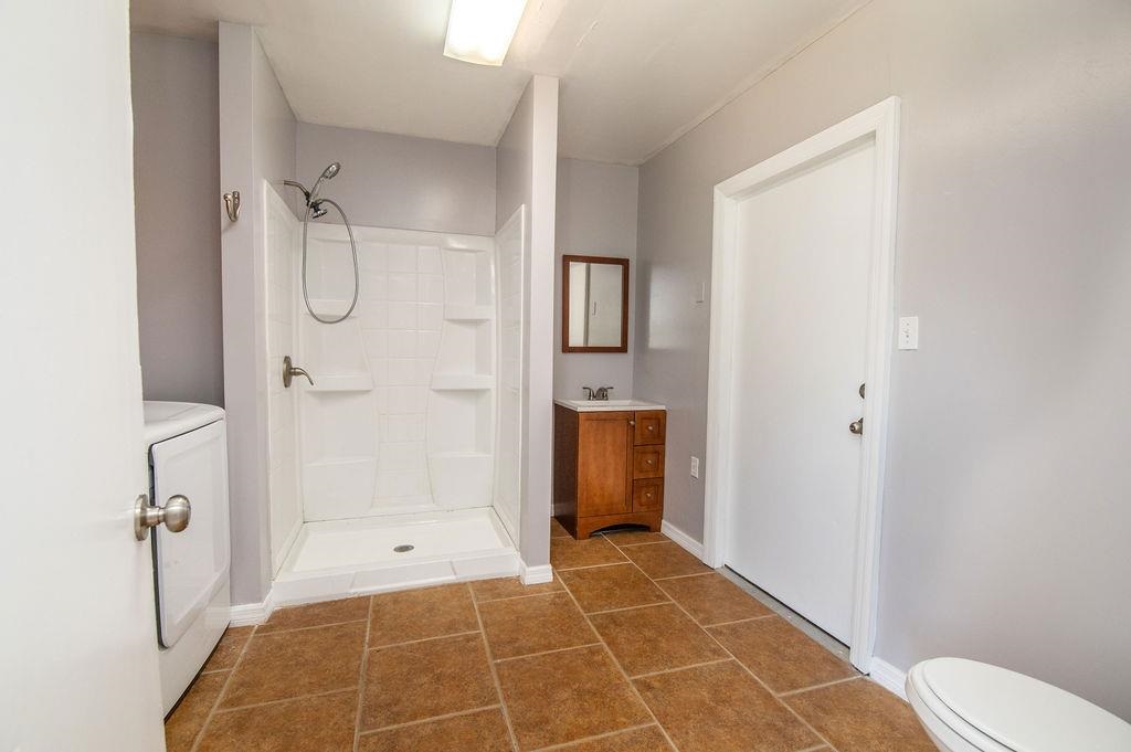 118 Menendez Road St. Augustine, FL 32080 - Photo 9 of 31 a bathroom with a glass door shower
