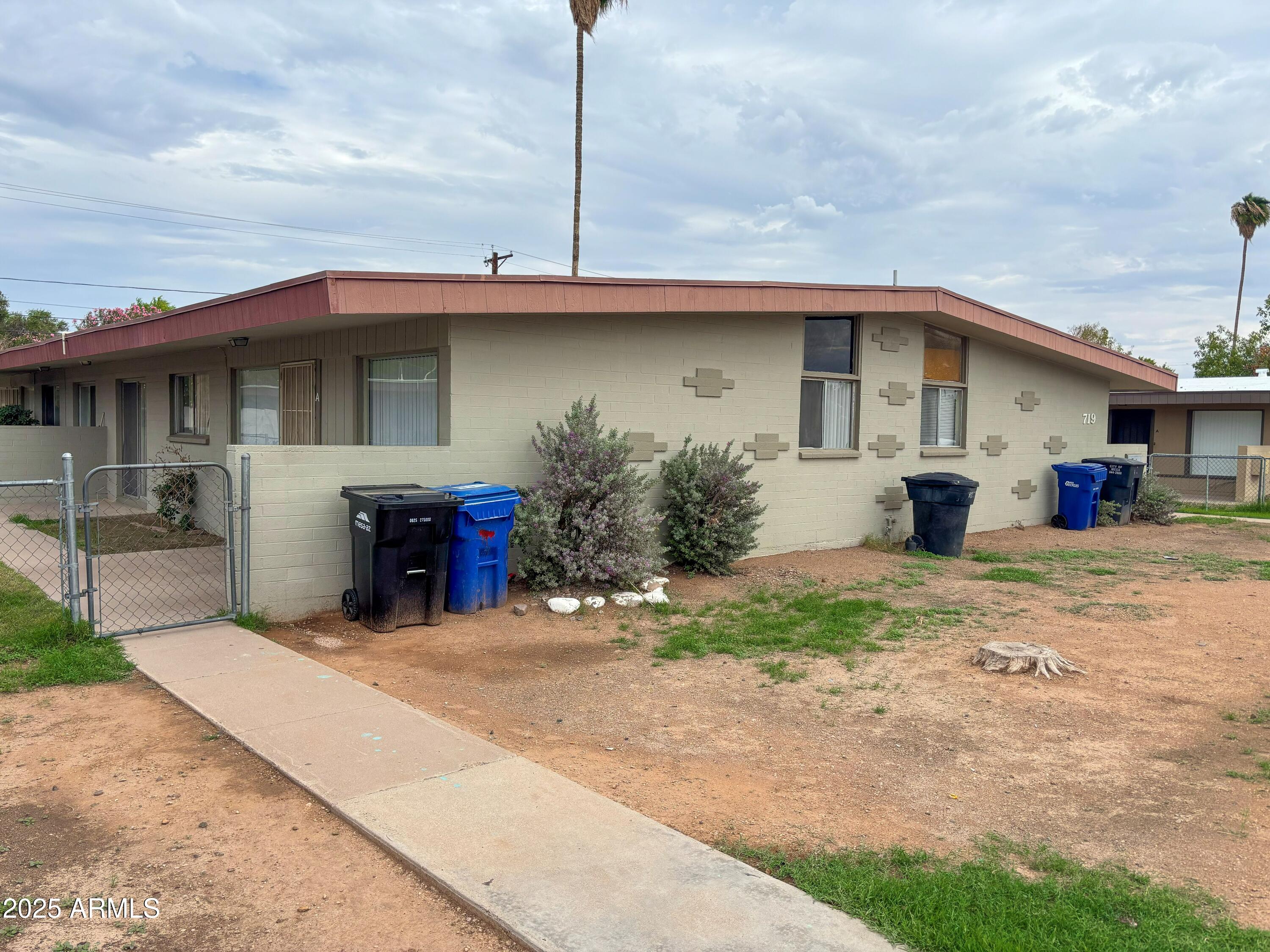 719 North Cherry Mesa, AZ 85201 - Photo 3 of 18 a view of a house with a patio and a yard
