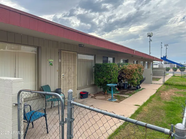 a front view of a house with sitting area