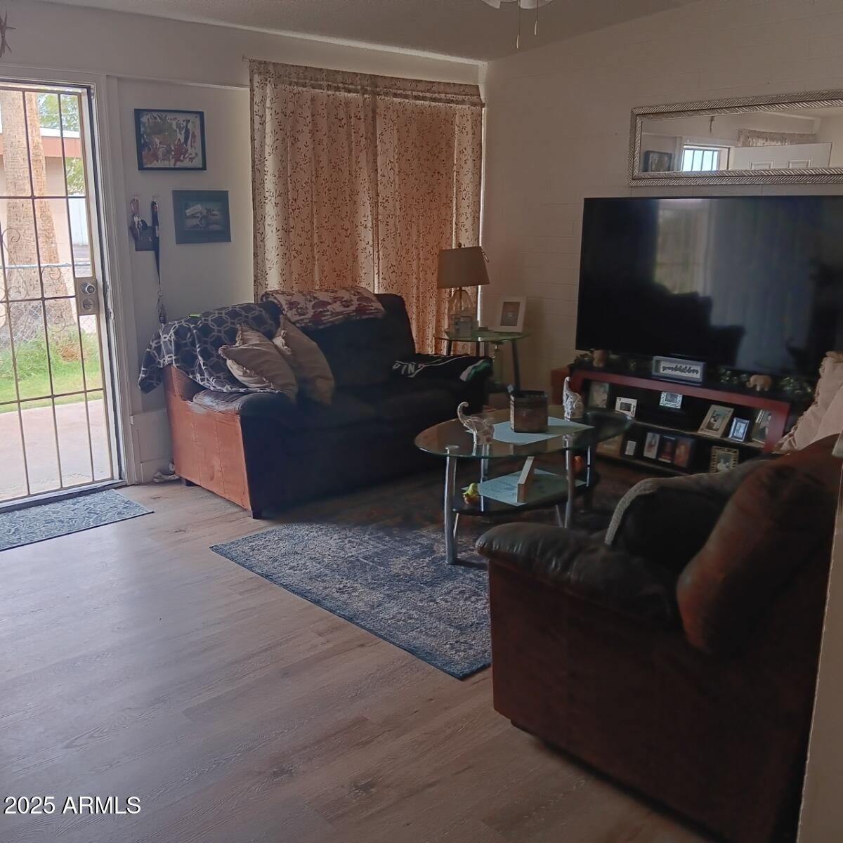 719 North Cherry Mesa, AZ 85201 - Photo 6 of 18 a living room with furniture and a flat screen tv