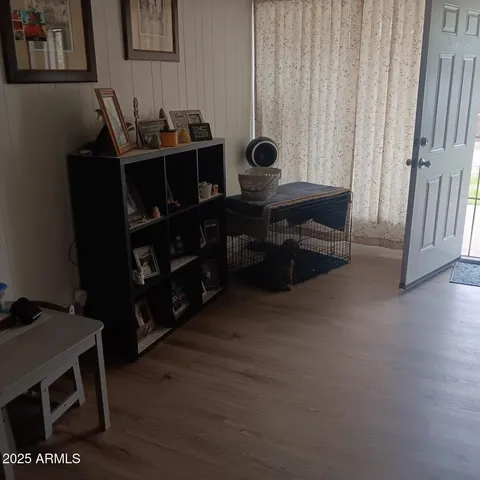 a room with furniture and wooden floor