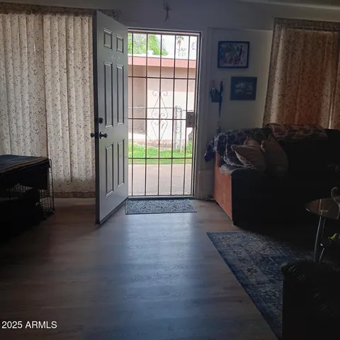 a living room with furniture and a gate