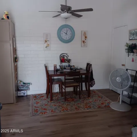 a view of a dining room and wooden floor