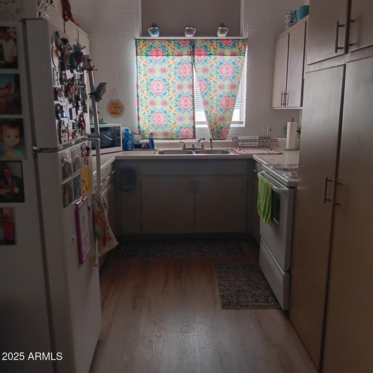 719 North Cherry Mesa, AZ 85201 - Photo 10 of 18 a kitchen with stainless steel appliances a refrigerator and a sink