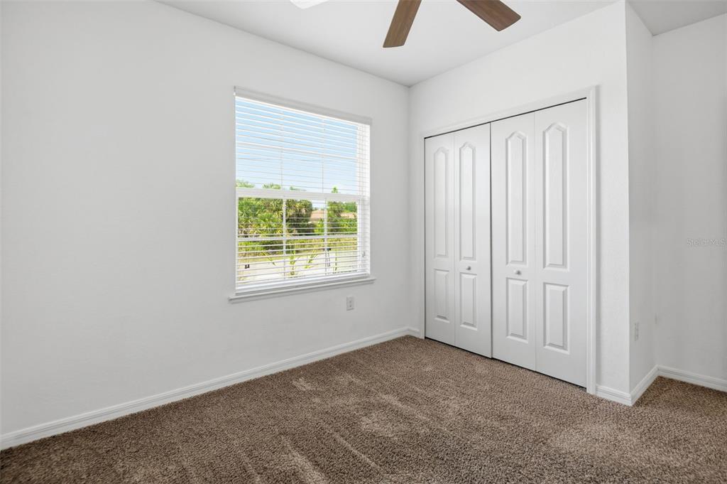4322 Kiska Road North Port, FL 34288 - Photo 20 of 37 an empty room with ceiling fan and window