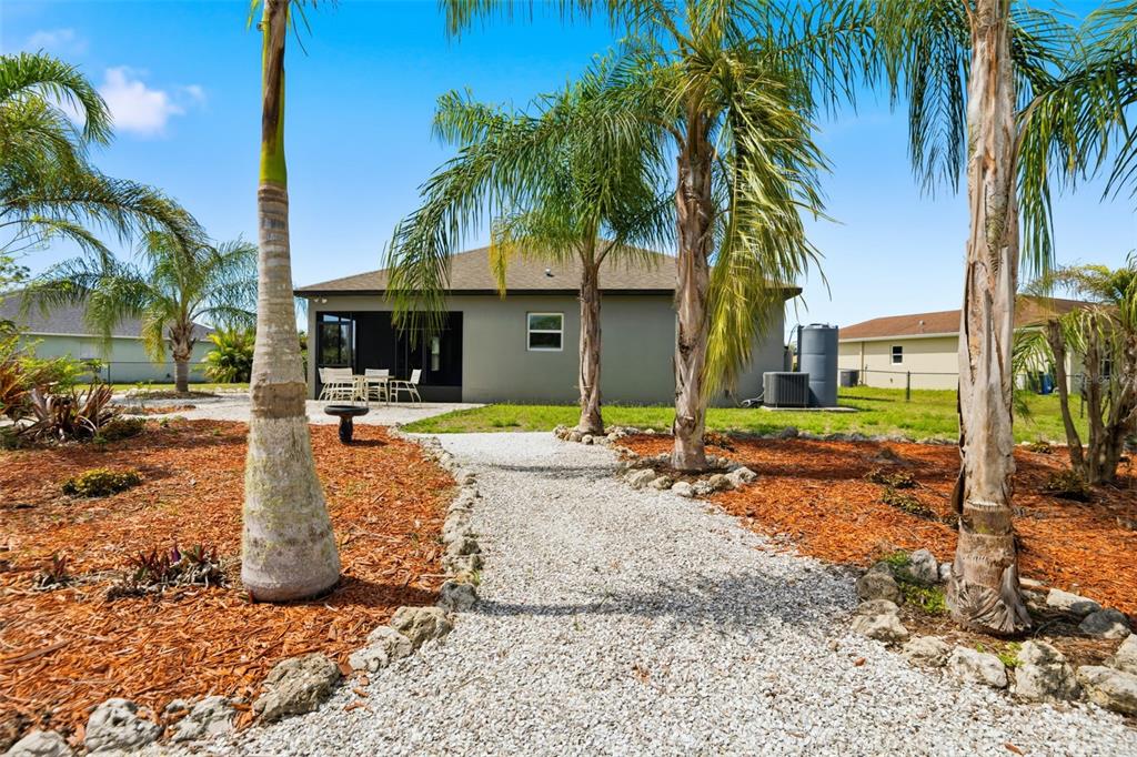4322 Kiska Road North Port, FL 34288 - Photo 28 of 37 a front view of a house with palm trees
