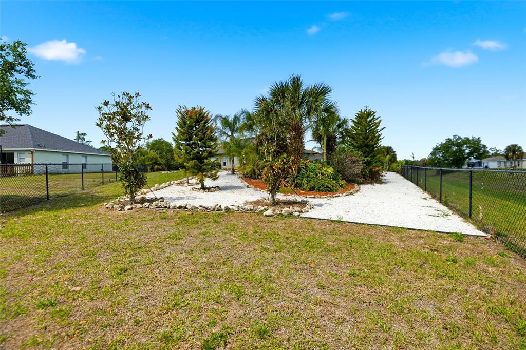 4322 Kiska Road North Port, FL 34288 - Photo 32 of 37 a view of a swimming pool with an outdoor space and seating area