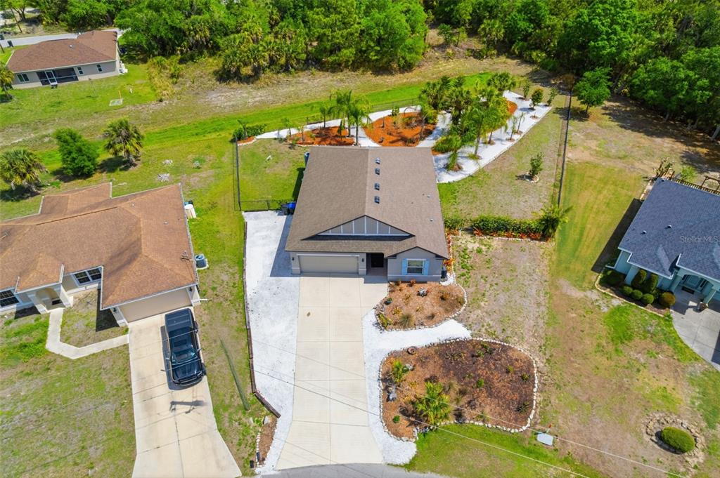 4322 Kiska Road North Port, FL 34288 - Photo 33 of 37 an aerial view of a house with a garden and swimming pool