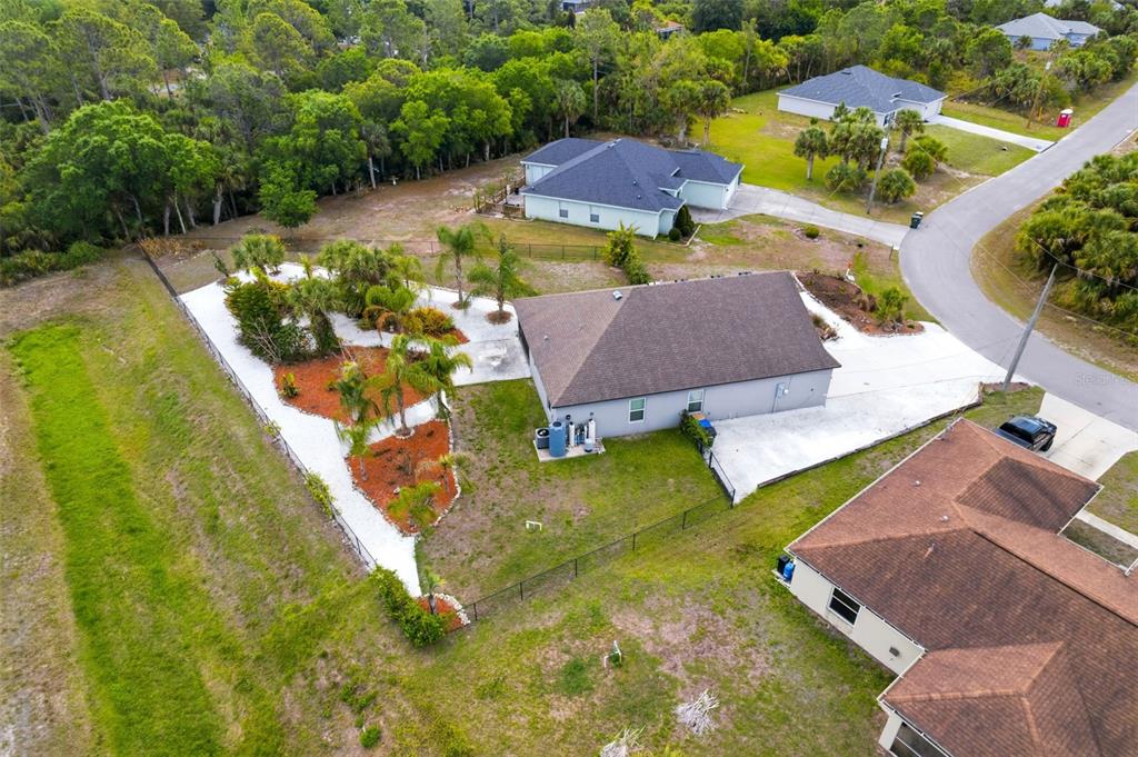 4322 Kiska Road North Port, FL 34288 - Photo 35 of 37 an aerial view of a house with a garden and lake view
