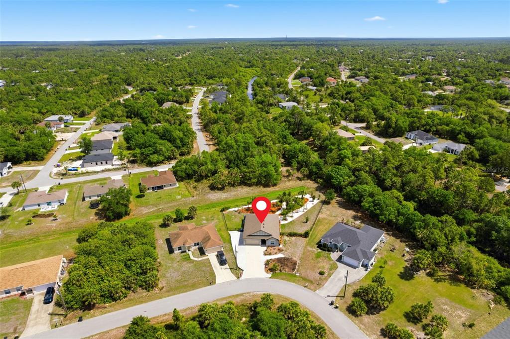 4322 Kiska Road North Port, FL 34288 - Photo 37 of 37 an aerial view of residential houses with outdoor space and trees all around