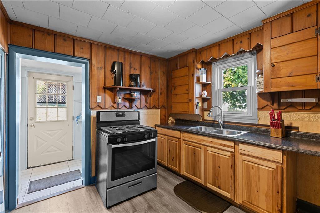 710 5th Street Charleroi, PA 15022 - Photo 13 of 30 a kitchen with stainless steel appliances granite countertop a stove a sink and a refrigerator