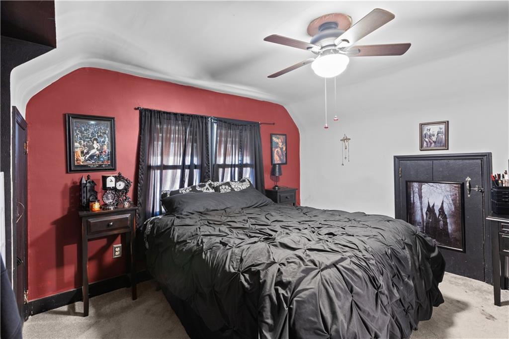 710 5th Street Charleroi, PA 15022 - Photo 18 of 30 a bedroom with a bed and a chandelier