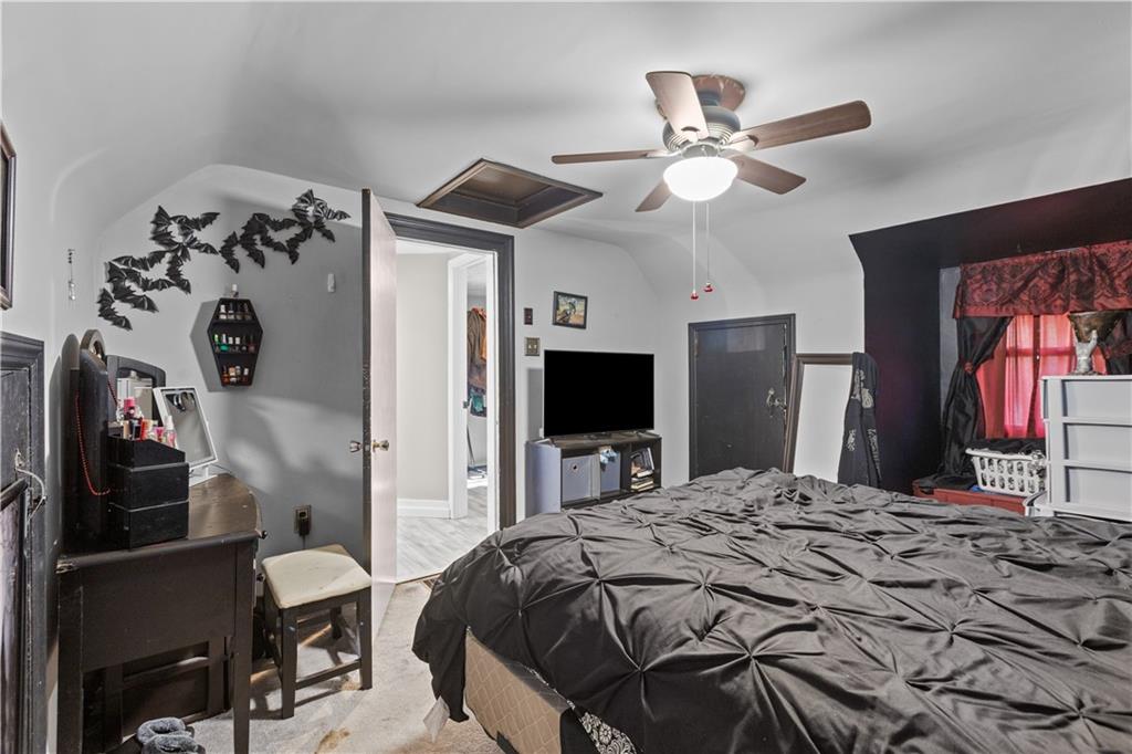 710 5th Street Charleroi, PA 15022 - Photo 19 of 30 a bedroom with a bed and a television