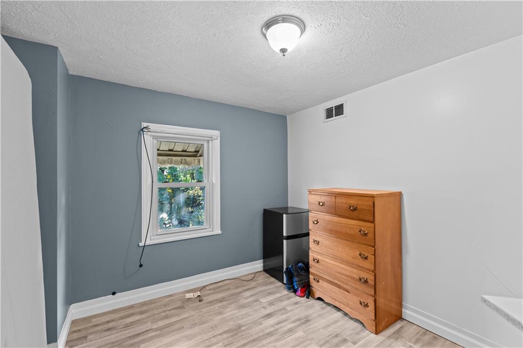 710 5th Street Charleroi, PA 15022 - Photo 20 of 30 a room that has a bed and a window