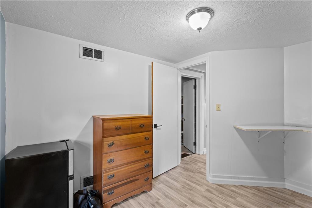 710 5th Street Charleroi, PA 15022 - Photo 21 of 30 a view of walk in closet with wooden floor