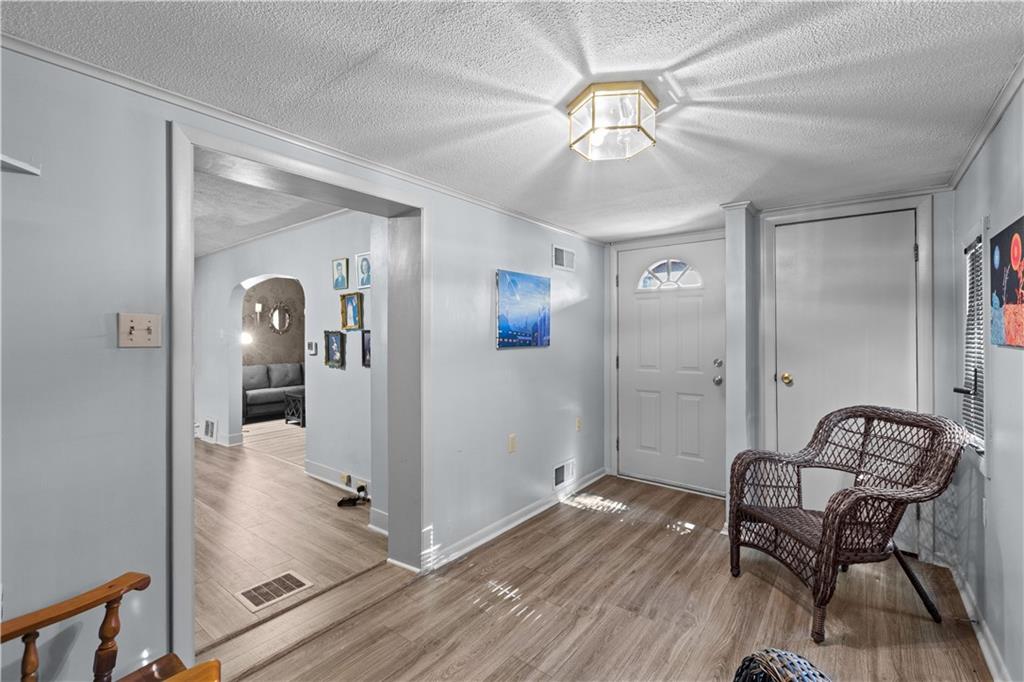 710 5th Street Charleroi, PA 15022 - Photo 5 of 30 a view of a hallway with wooden floor and workspace