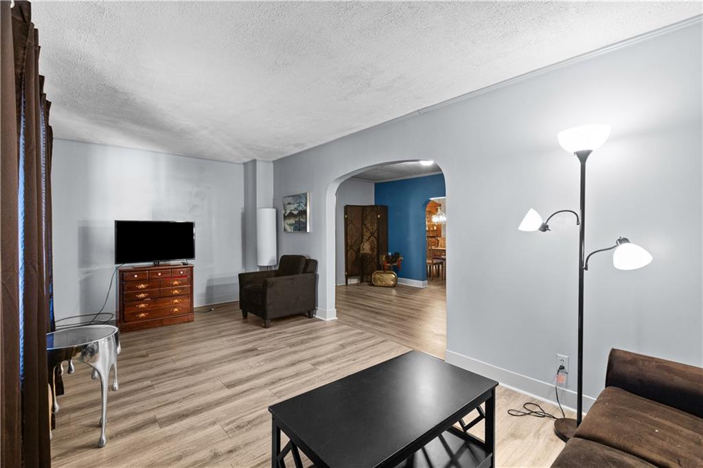 710 5th Street Charleroi, PA 15022 - Photo 8 of 30 a living room with furniture and a flat screen tv