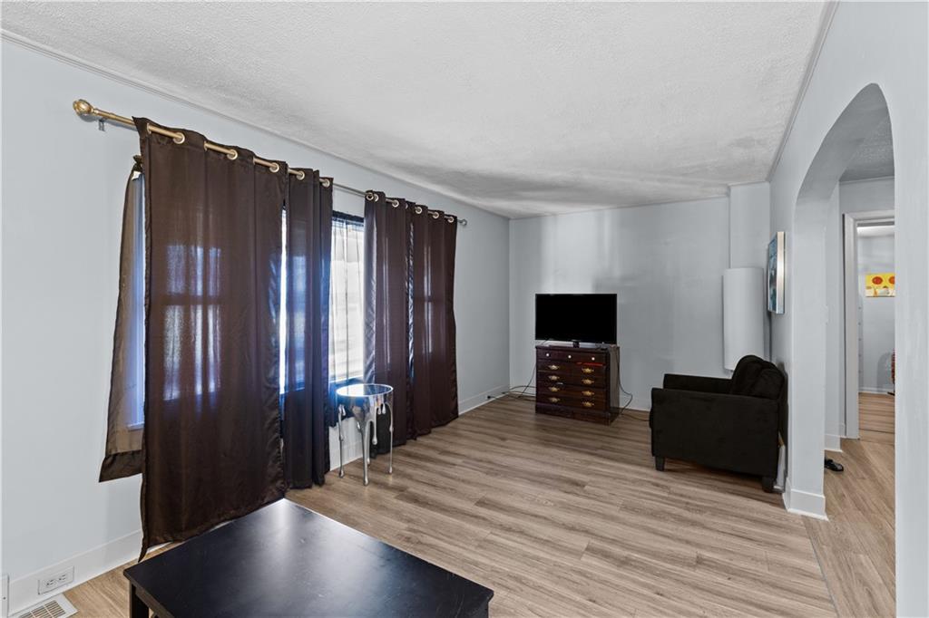 710 5th Street Charleroi, PA 15022 - Photo 10 of 30 a living room with furniture and a flat screen tv