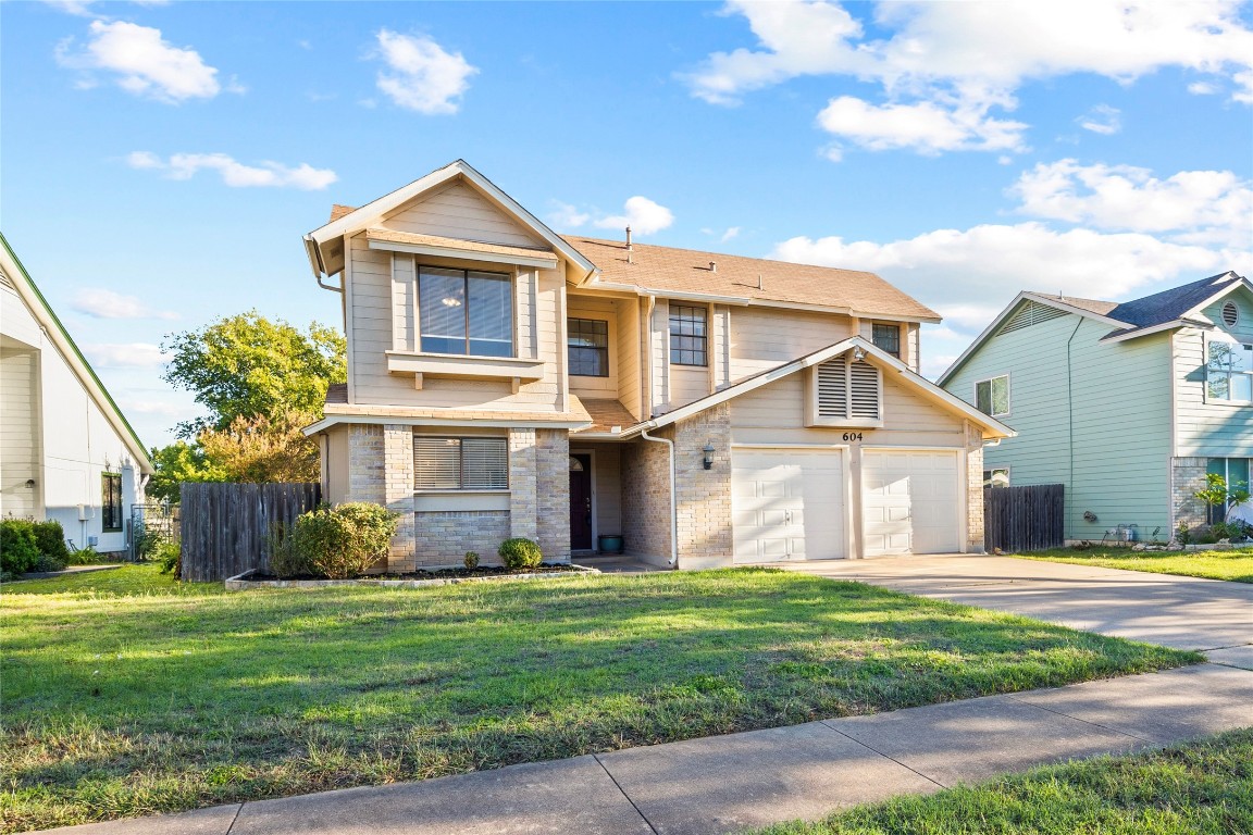 604 Brookside Pass Cedar Park, TX 78613 - Photo 1 of 1 a front view of a house with garden