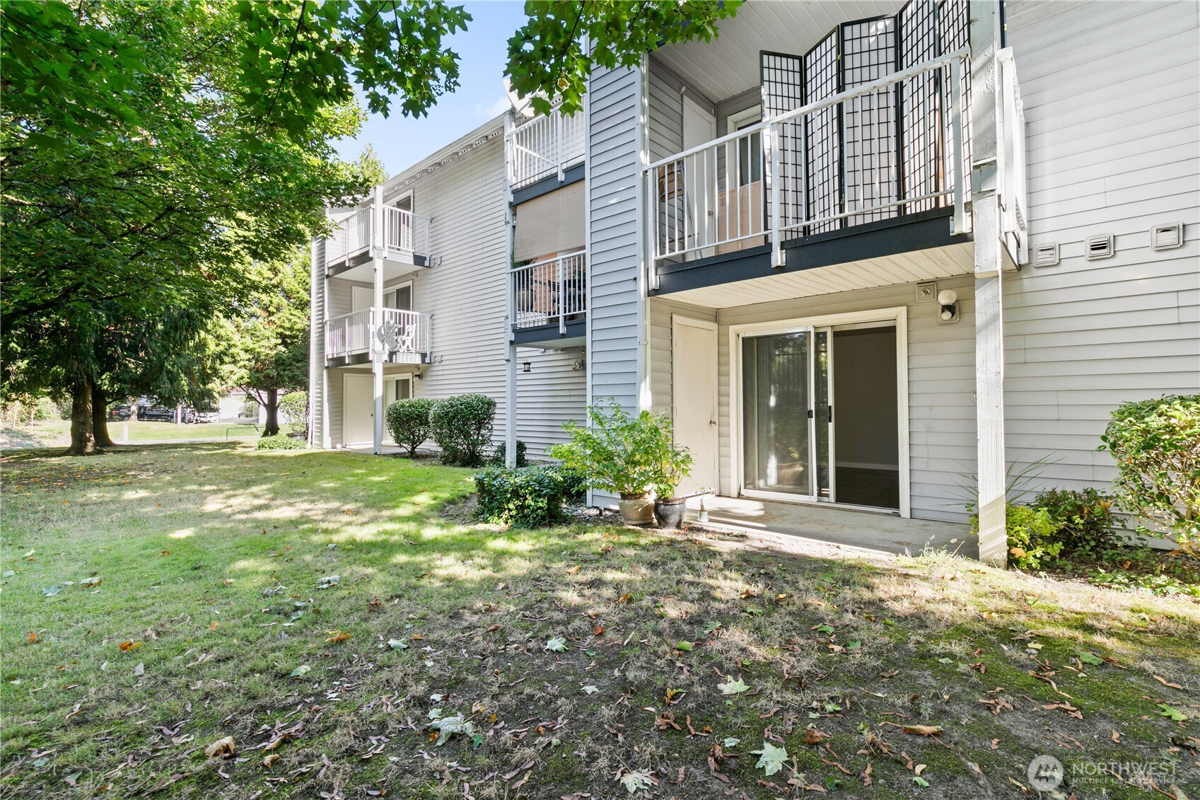 7453 Newcastle Golf Club Road, Unit M103 Newcastle, WA 98059 - Photo 12 of 18 front view of a house with a yard