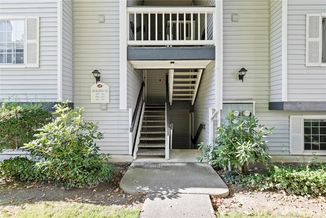 a front view of a house with stairs