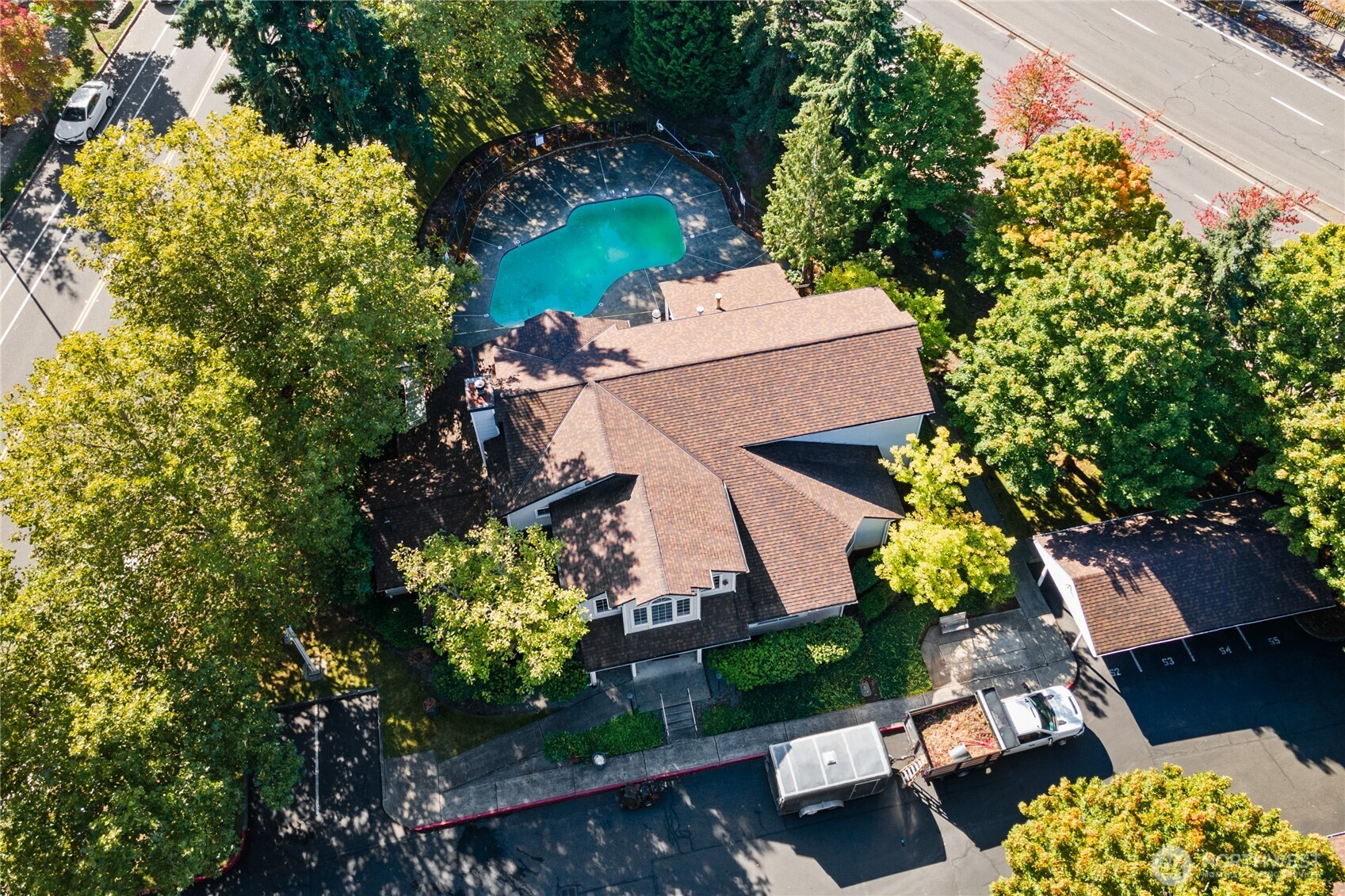 7453 Newcastle Golf Club Road, Unit M103 Newcastle, WA 98059 - Photo 16 of 18 an aerial view of a house with a yard and garden