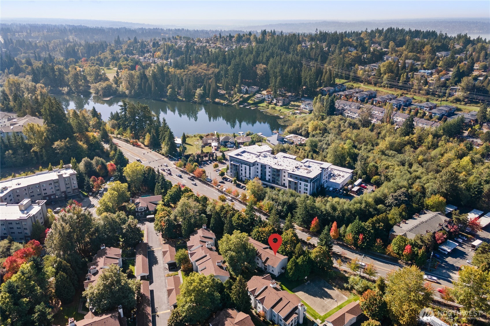 7453 Newcastle Golf Club Road, Unit M103 Newcastle, WA 98059 - Photo 2 of 18 an aerial view of lake and residential houses